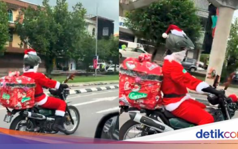 Keren! Ojol Meriahkan Natal, Antar Makanan Pakai Kostum Santa Claus